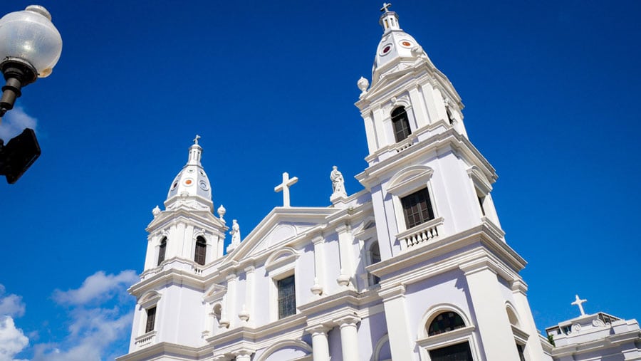 The white Ponce Cathedral and the clear blue sly during a sunny day