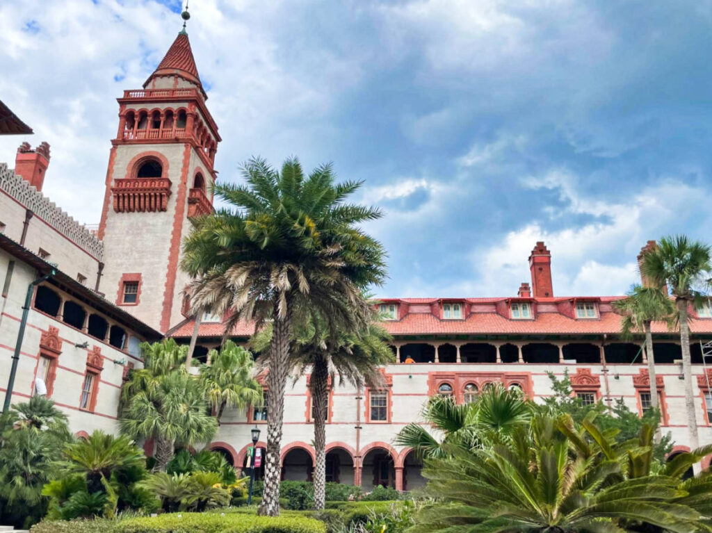 Exterior view of the Ponce de Leon Hotel surrounded by greenery