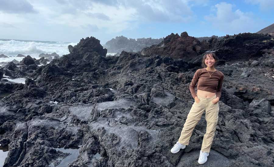 The author smiling for a photo in Ponta da Ferraria