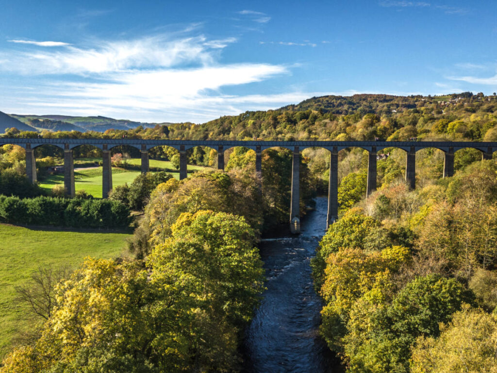 Panoramic view of the Pontcysyllte Aqueduct over the greenery and canal