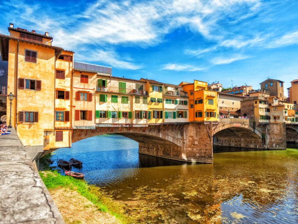 Colorful buildings and Ponte Vecchio bridge over the river