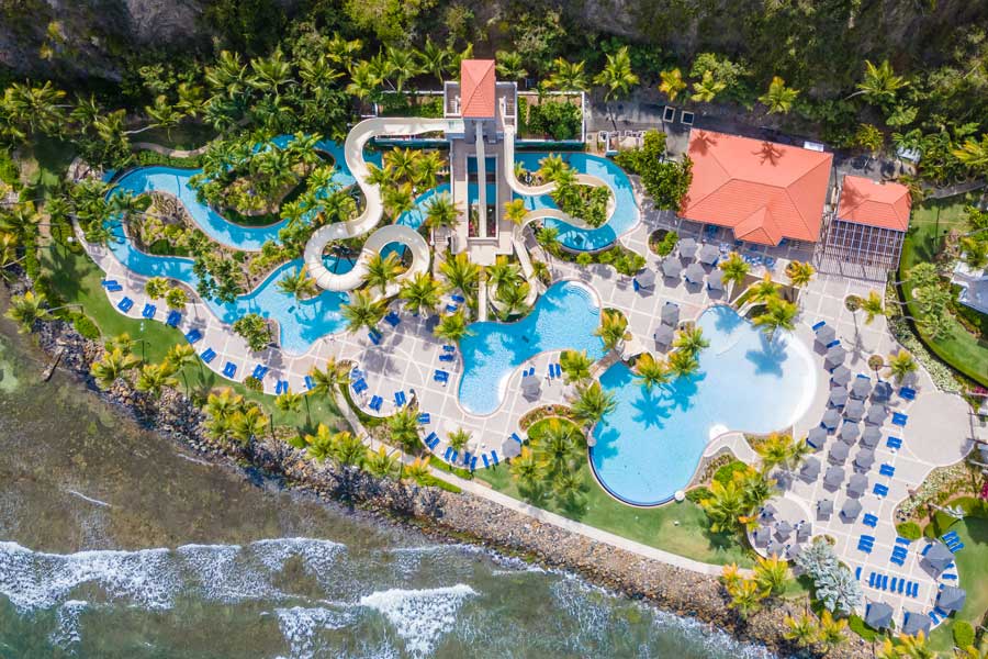 Aerial view of a pool with slides in El Conquistador Resort