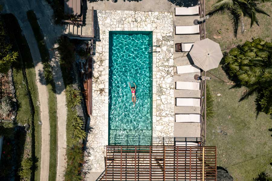 Aerial view of a woman on a pool in Casa Grande Mountain Retreat