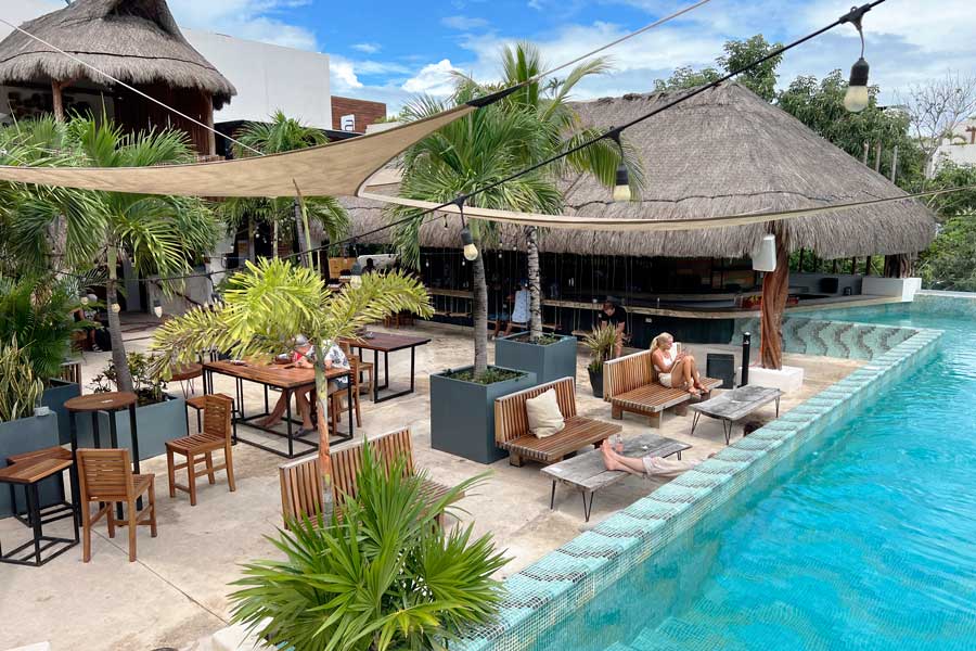 People at the pool area of Mayan Monkey Tulum