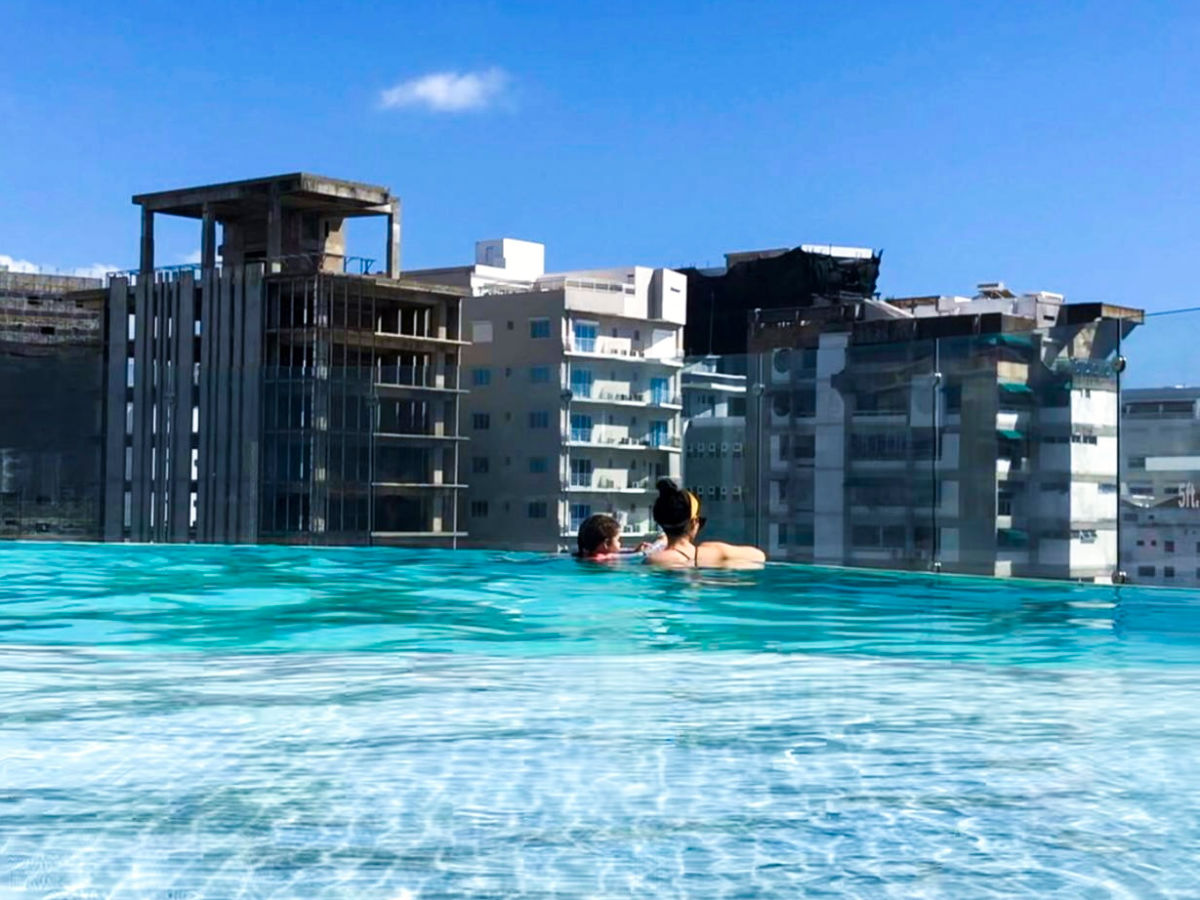 Author Claudicet and her daughter swimming in the pool at InterContinental Real Santo Domingo