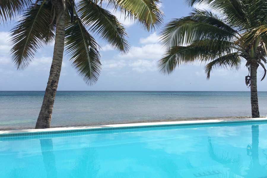 View of the beach from the pool area in Bravo Beach Hotel