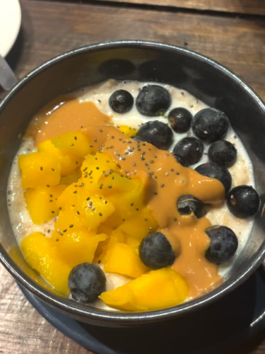 A porridge bowl with fruit served at Floresta Cafe