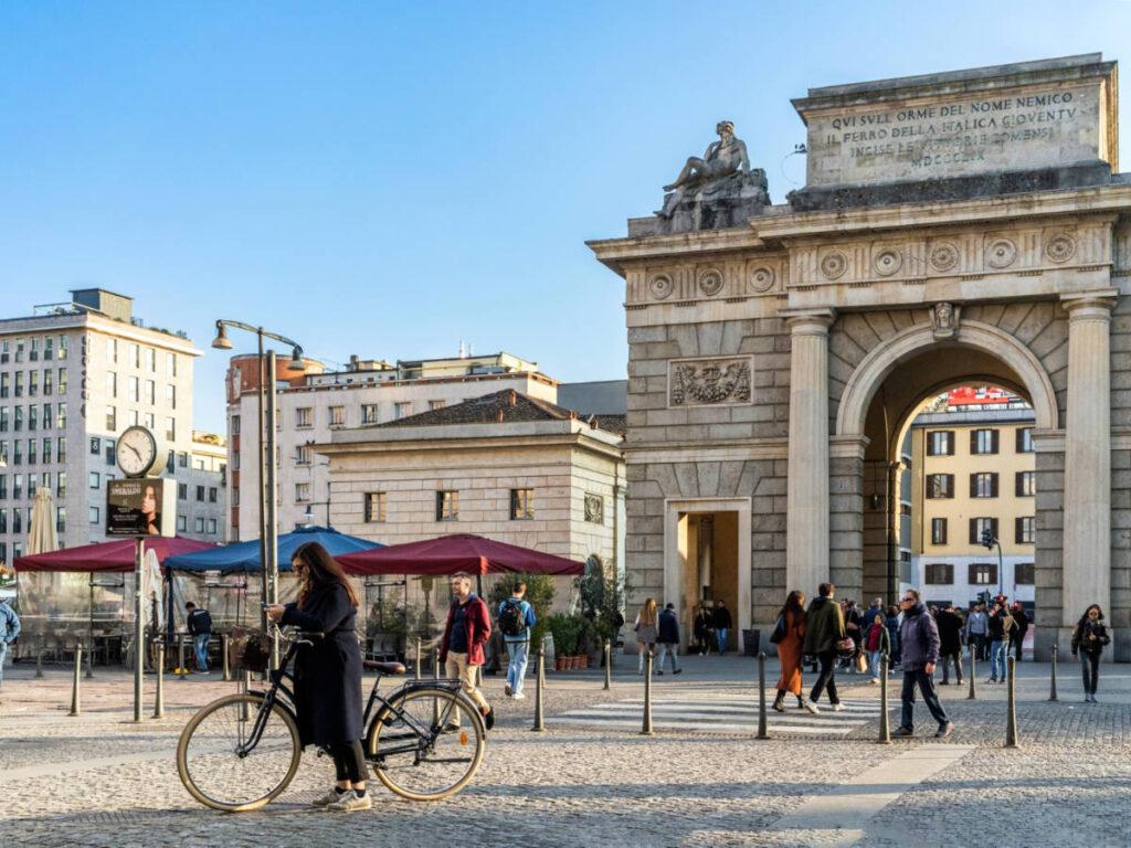 People entering and exiting the Porta Garibaldi gate