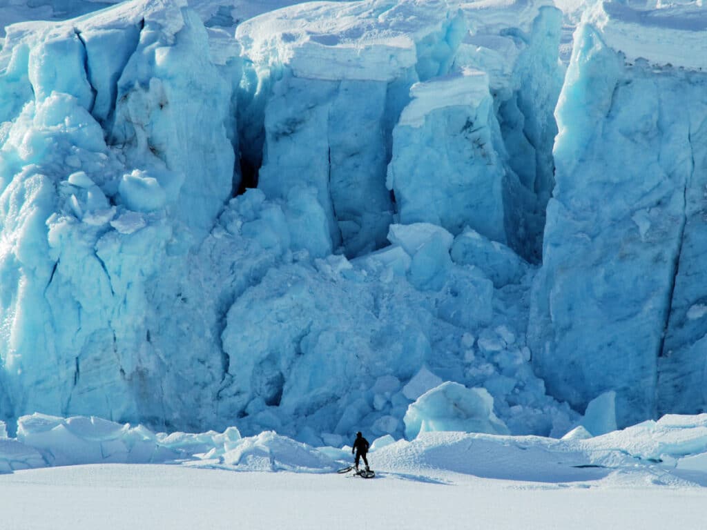 A hiker in front of the Portage Glacier