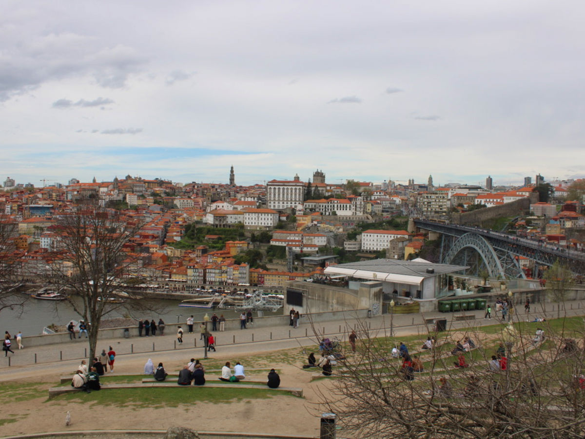 Groups of people hanging out at a free Porto viewpoint