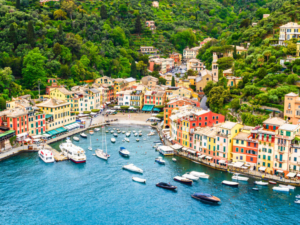 Aerial view of the beautiful colorful buildings and sailing boats on Portofino