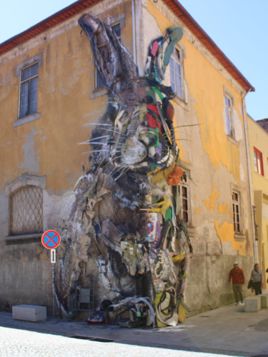 View of the the colorful Half Rabbit 3D mural on a building on Porto