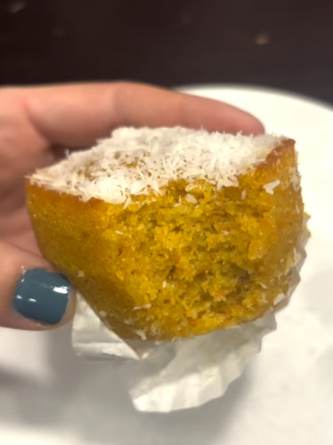 Holding a Portuguese carrot cake served at Padeirinha Doce
