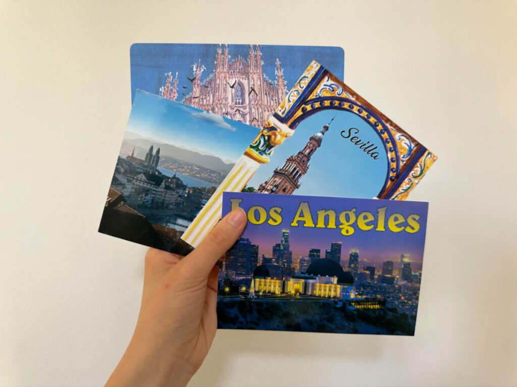 Holding Postcards from different places