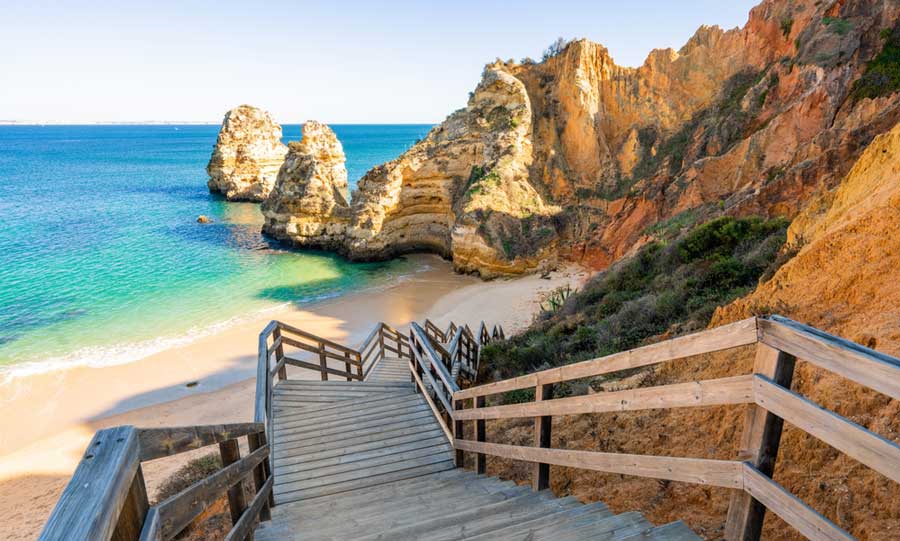 A staircase leading to the Praia do Camilo