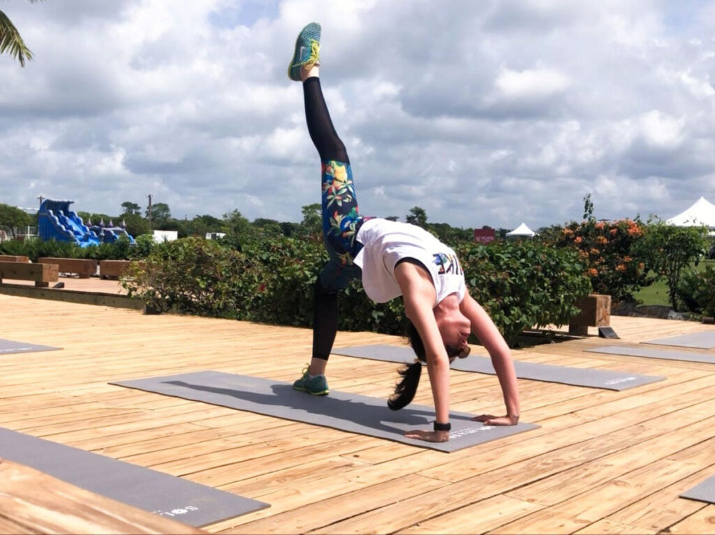 Author Claudicet attending a Pre-yoga class at Global Wellness Day