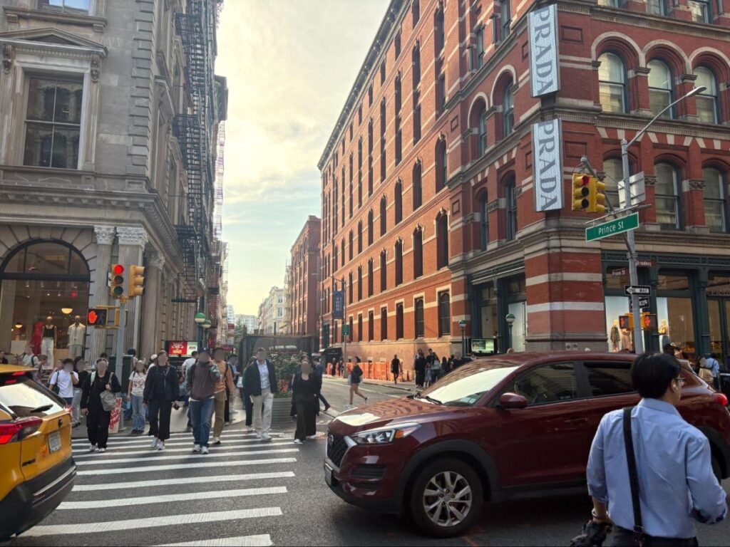 People crossing the pedestrian lane at Prince Street