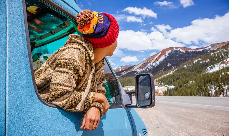 View of a woman leaning on a window vehicle