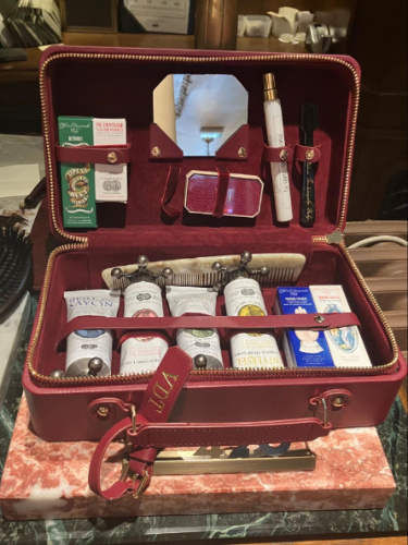 A bag with luxury products inside from Officine Universelle Buly 1803