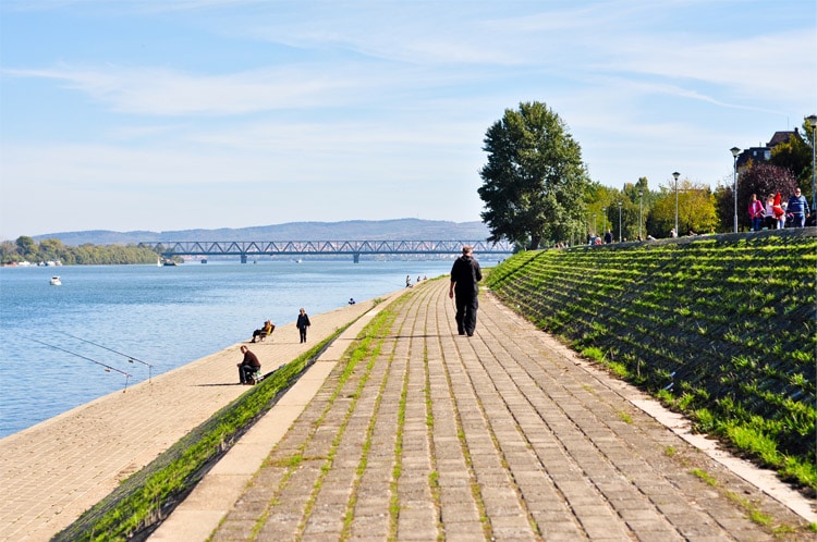 People walking along a pathway in Promenade Along Danube