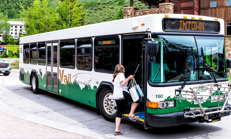 A woman riding a public transit bus in Vail