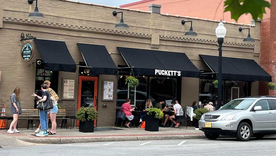 View of people outside the Puckett’s Grocery