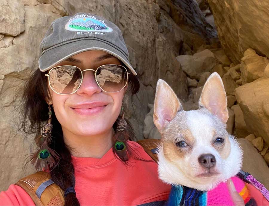 The author holding her dog in Pueblo Alto Trail