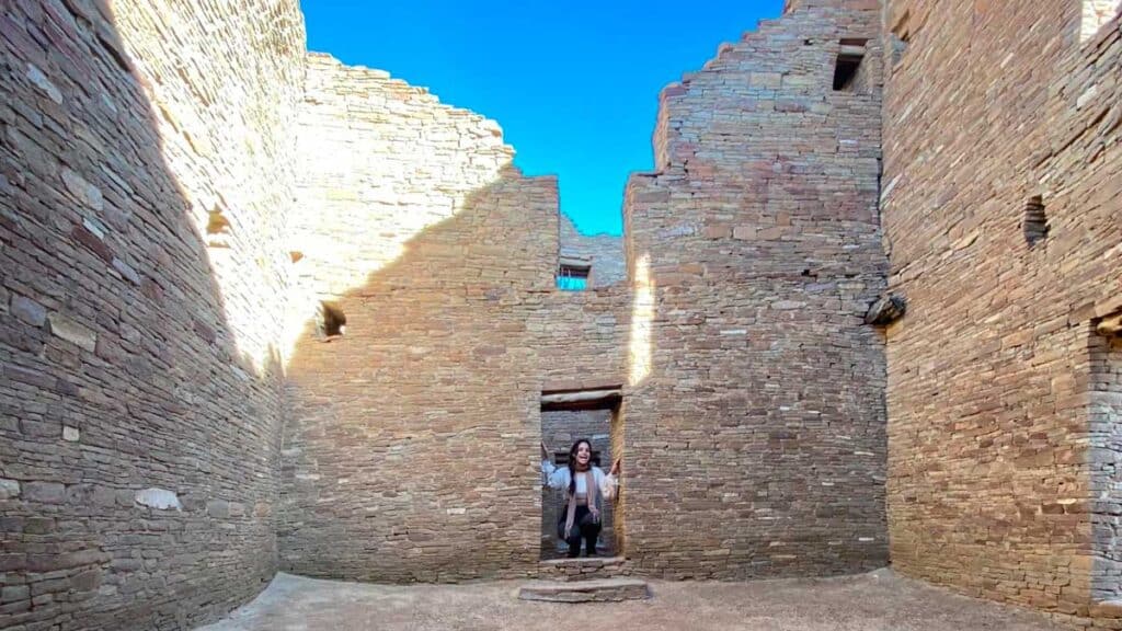 The author smiling for a photo in Pueblo Bonito