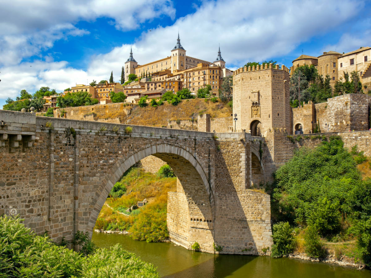 Cityscape of Toledo with the Alcantara bridge in the forefront
