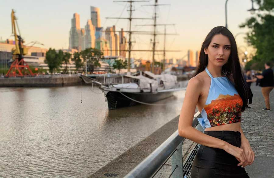 Clara posing for a photo during sunset in Puerto Madero