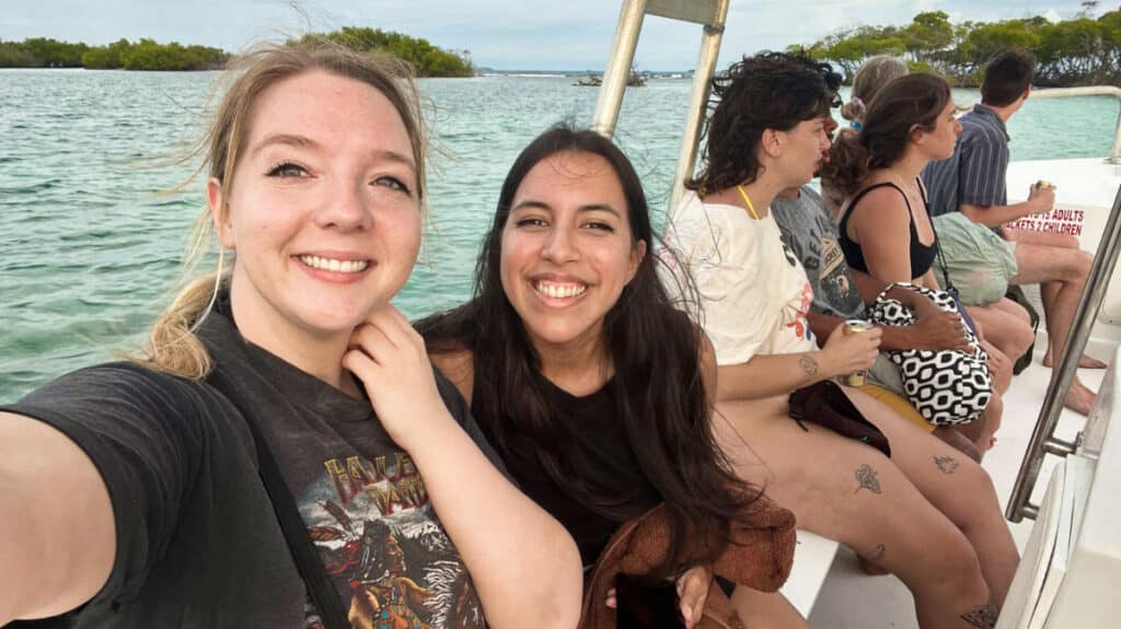 The author, Vanessa Ramos with Travel Lemming's Taylor on a boat tour in Puerto Rico