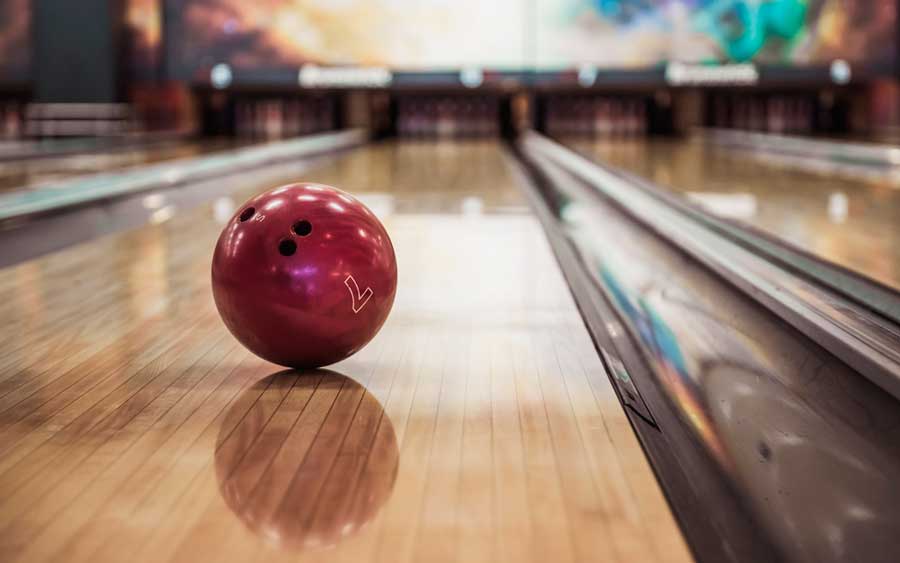 A bowling ball on a bowling alley in Punch Bowl Social
