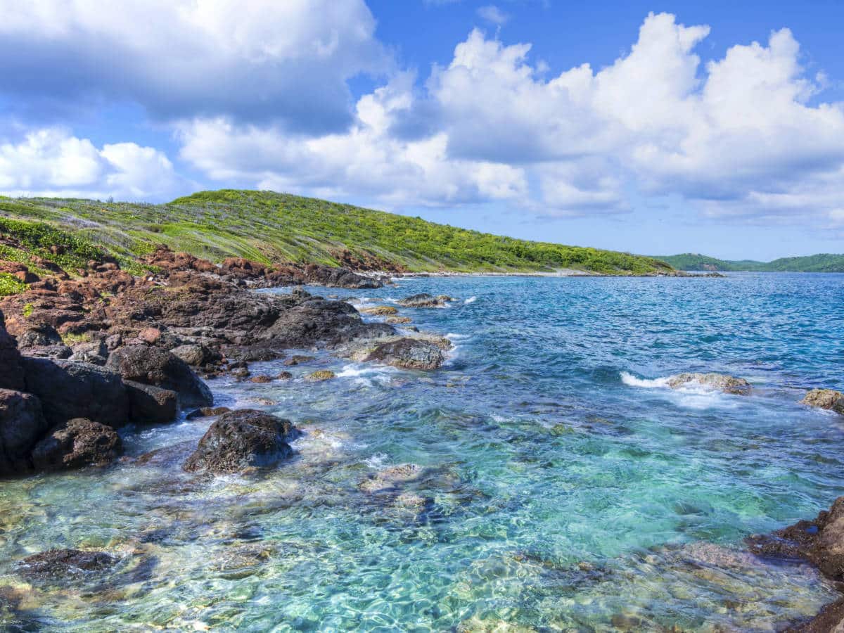 View of clear water and rock formations at the Punta Soldado Beach