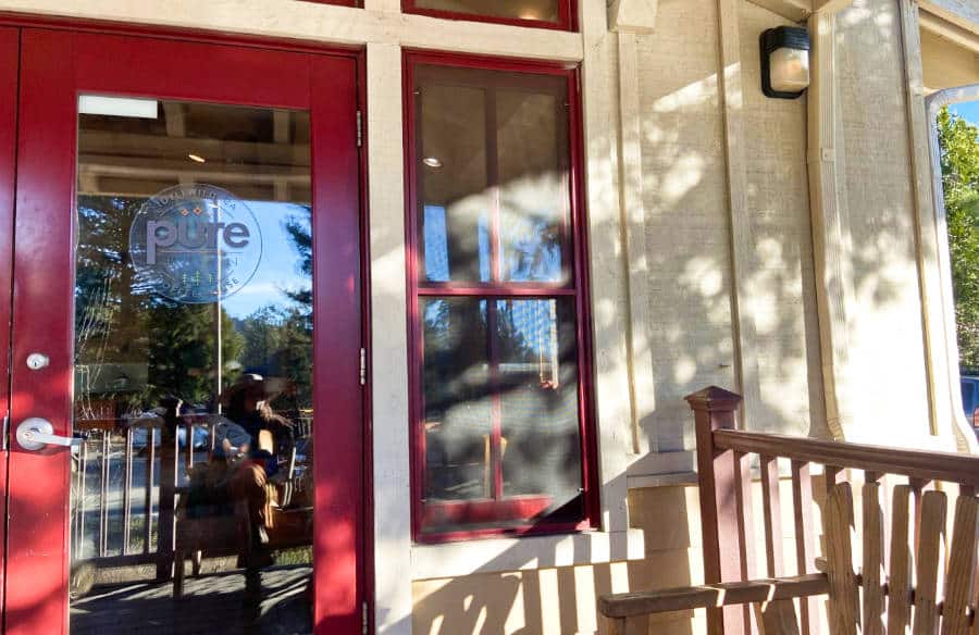 A silhouette reflected on the coffee house door of Pure Bean Idy