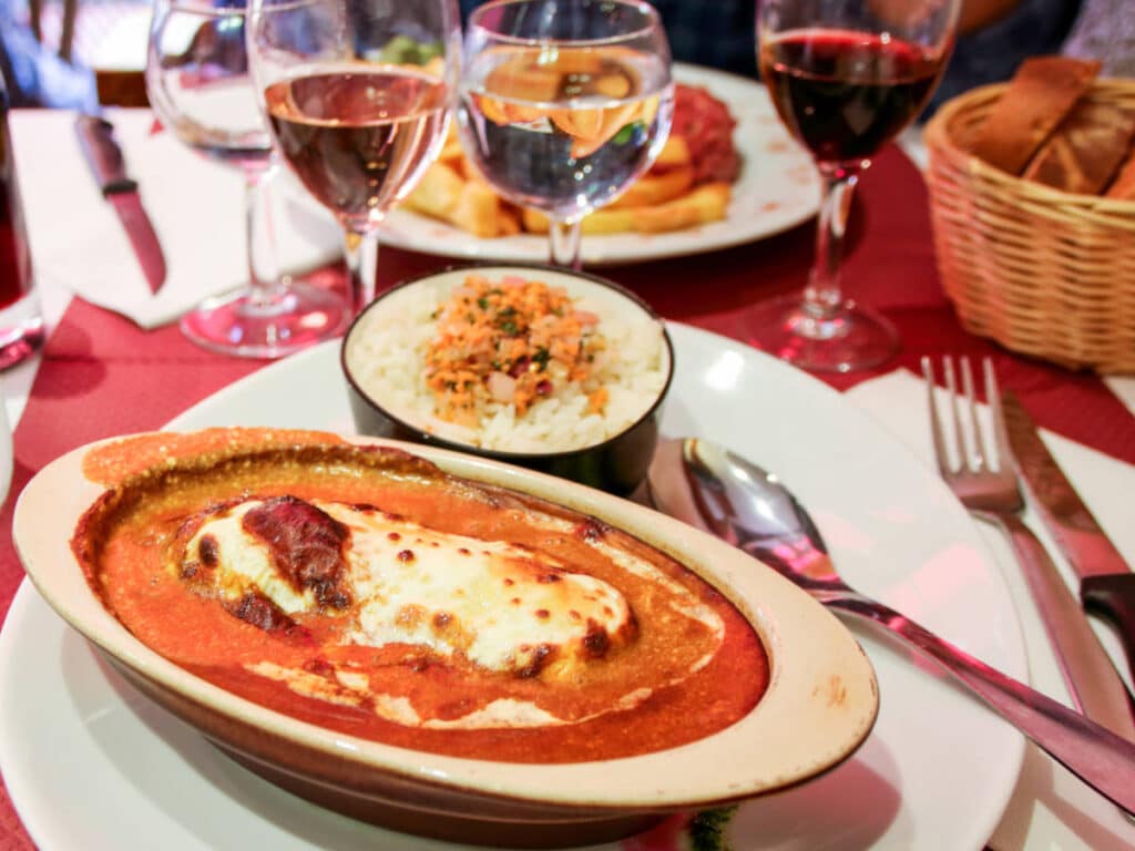 A Quenelle dish served with wine on a restaurant in France