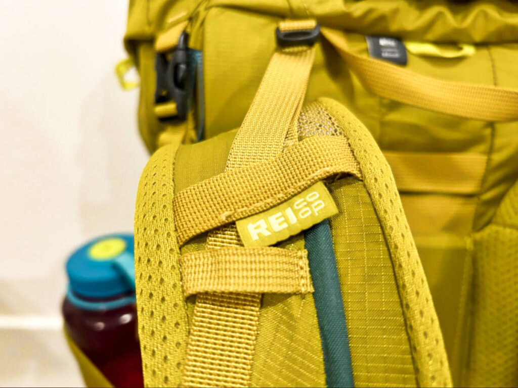 Closeup look at the logo on the shoulder strap of the REI Co-Op Flash 55 Backpack