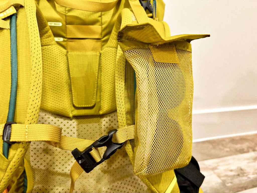 A sunglass inside the removable shoulder strap pocket of the REI Co-Op Flash 55 Backpack