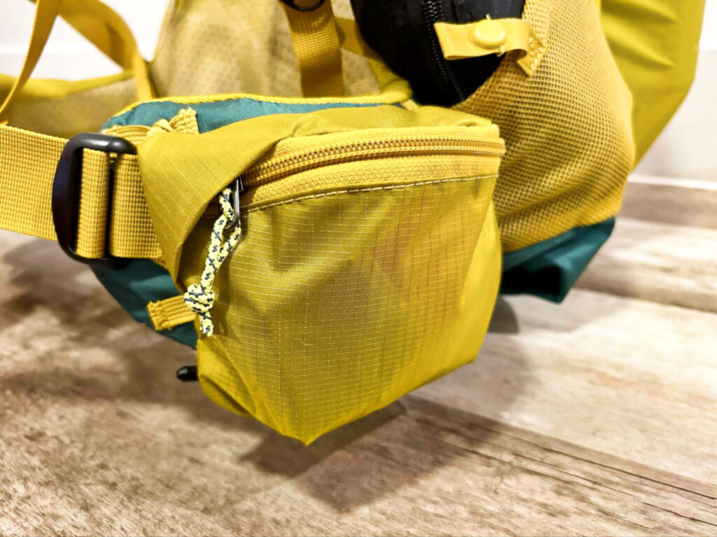 A small pocket in the hip belt of Outside Pockets of REI Co-Op Flash 55 Backpack