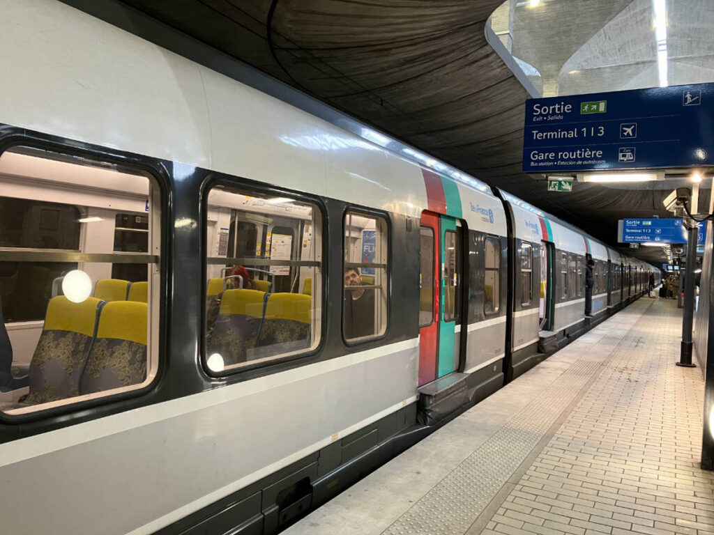 The RER train stopping on one of its stations