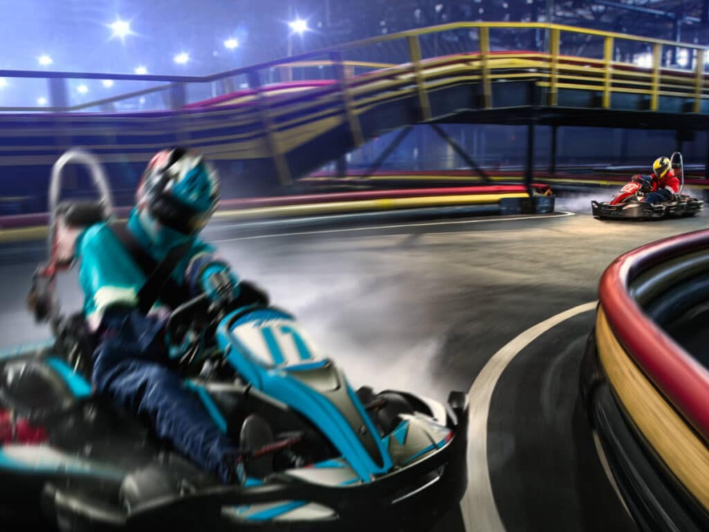 Two people on their go-kart racing at the RPM Raceway