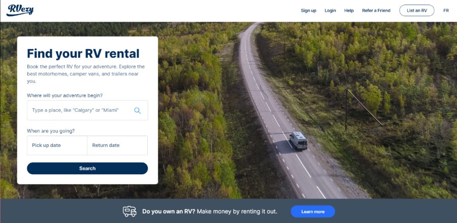 The user interface of RVezy homepage with a camper van on the highway with trees around