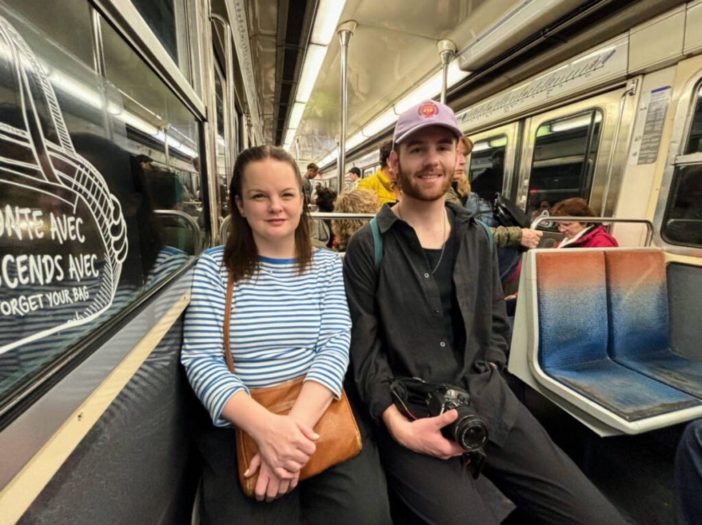 The author Rachel Kapelke-Dale with Michael sitting inside the metro