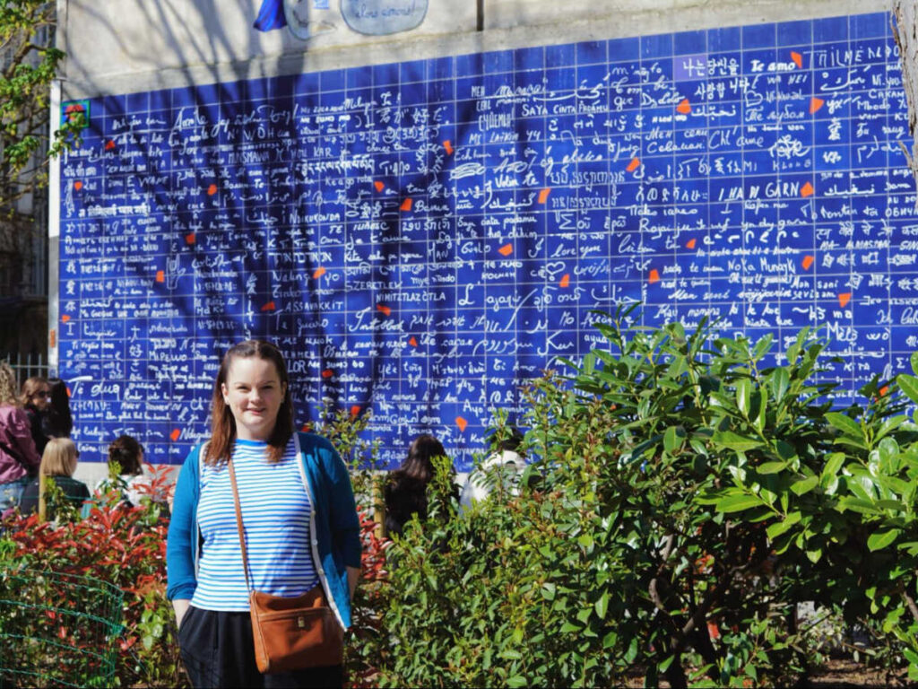 The author Rachel Kapelke-Dale in front of the “I Love You” Wall