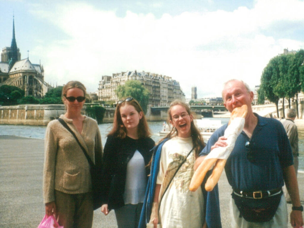 The author Rachel and her family, posing for a photo in front of the Notre Dame