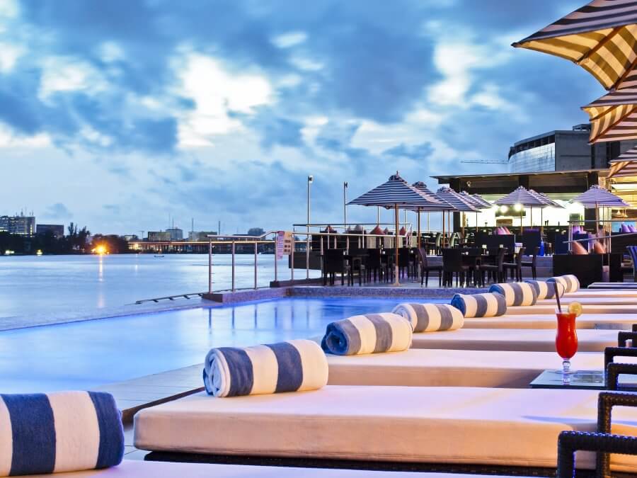 Best Hotel for Business Travelers in Lagos Nigeria: Radisson Blu Anchorage Hotel View of the lounge chairs at the rooftop poolside of Radisson