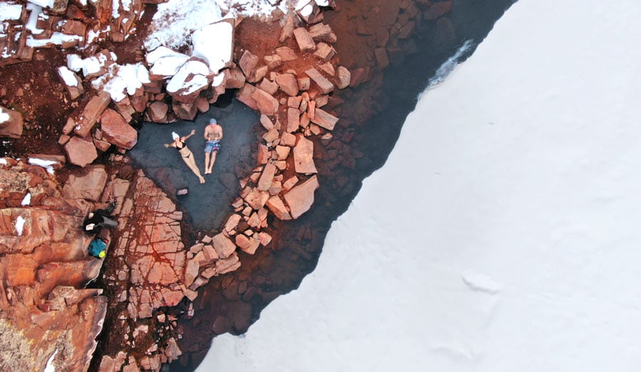 Aerial view of a man and woman relaxing in the Radium Hot Springs