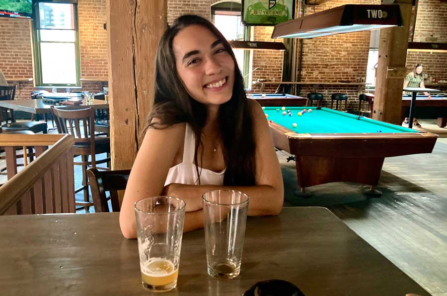 The author posing for a photo after a pool game in Wynkoop Brewing Company