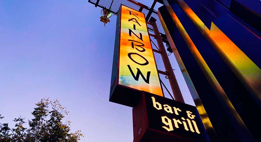 The Rainbow Bar & Grill signage with lights at night
