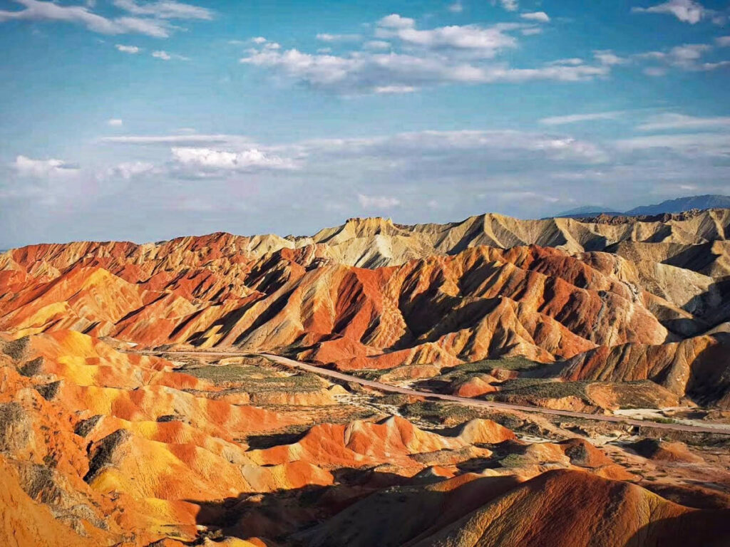 Panoramic view of the rainbow mountains at sunset