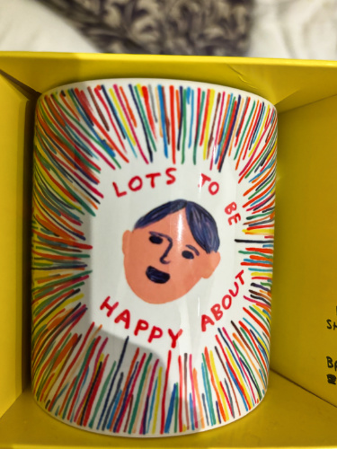 A colorful mug from Red Door Gallery